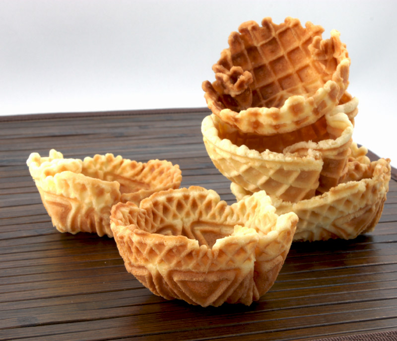 Waffle Cups A photo of 5 waffle cups on a wooden placemat.