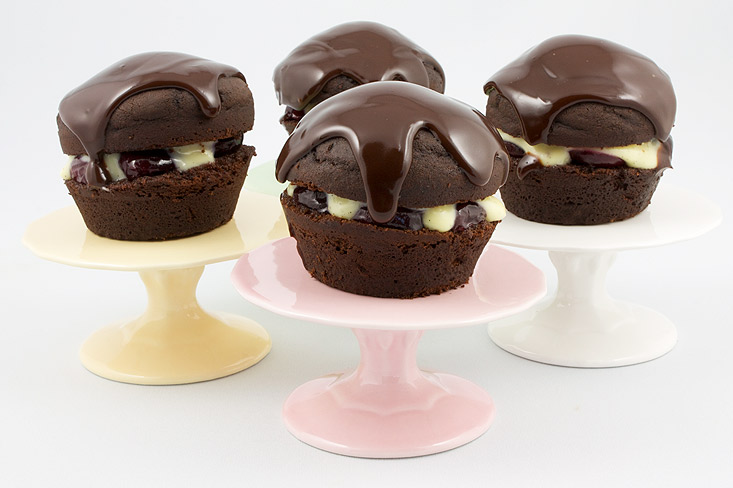 Martha Stewart's Black Forest Cupcakes A photo of 4 black forest cupcakes on mini cake stands (pink, white, green & yellow)