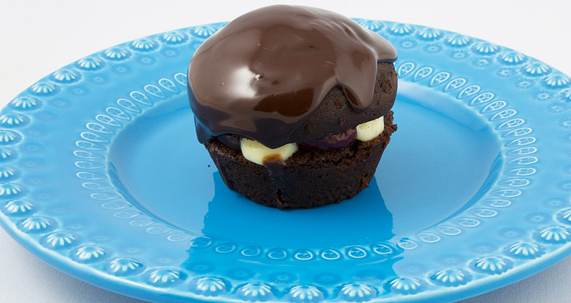 Martha Stewart's Black Forest Cupcakes A photo of a black forest cupcake on a blue plate.