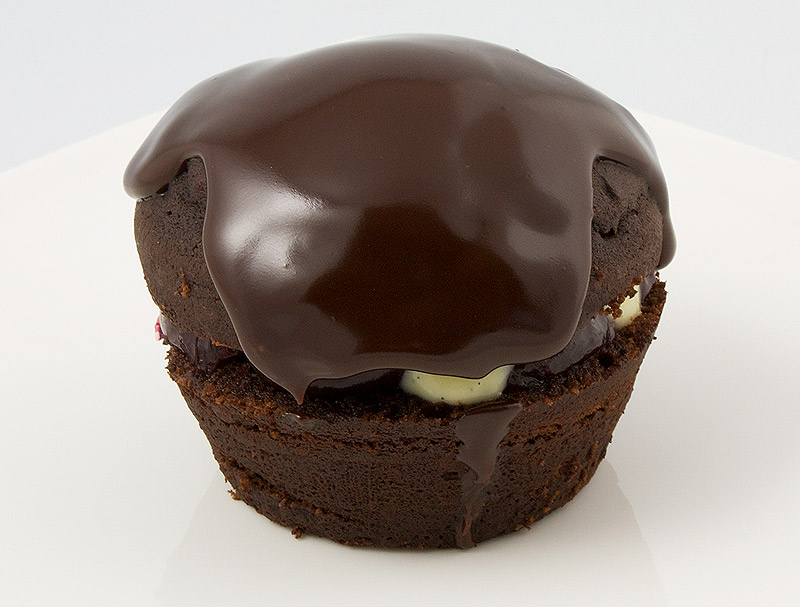 Martha Stewart's Black Forest Cupcakes A photo of a black forest cupcake on a white dish.