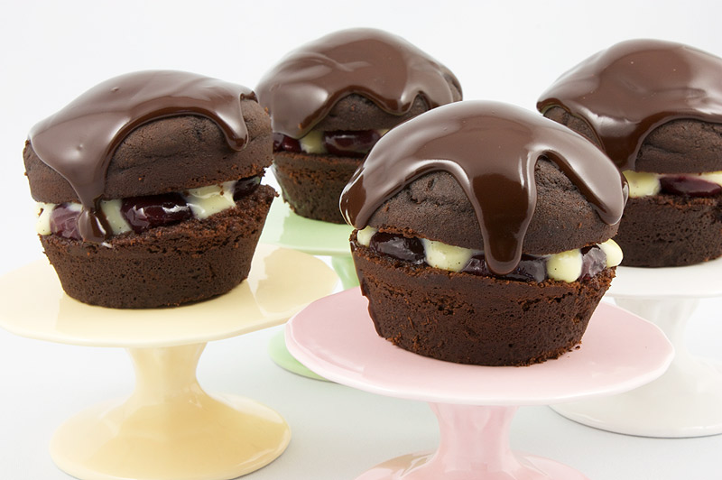 Martha Stewart's Black Forest Cupcakes A photo of 4 black forest cupcakes on mini cake stands (pink, white, green & yellow)