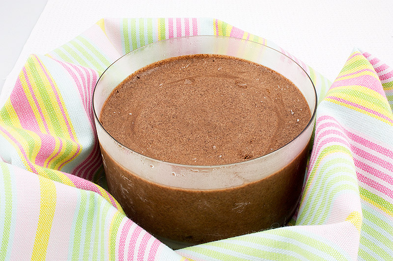 frozen treat recipes, recipe for Donna Hay's double chocolate brownie semifreddo, Italian semifreddo recipes A photo of a large bowl of double chocolate brownie semifreddo nestled in a crumpled, multi-coloured tea towel.