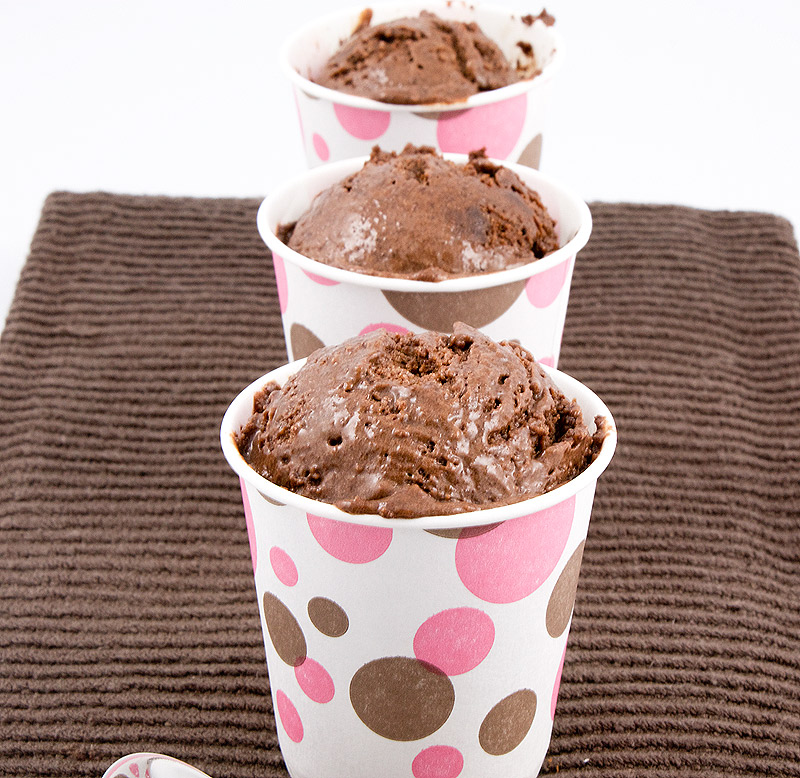 Italian semifreddo dessert recipes, Donna Hay's double chocolate brownie semifreddo recipe, Donna Hay's double chocolate brownie semifreddo A photo of 3 double chocolate brownie semifreddo desserts, served in pink and brown polka dotted cups, lined up in a row placed on a brown tea towel.