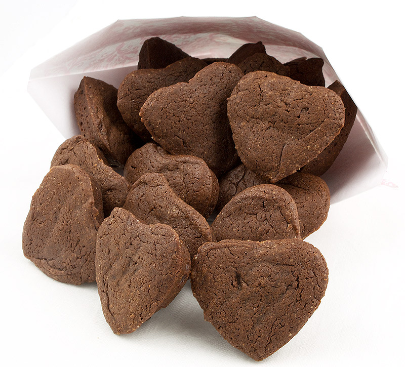 brownie hearts, chocolate brownie hearts, brownie truffles, Martha Stewart recipes A photo of mini brownie hearts falling out of a pink and white paper bag.