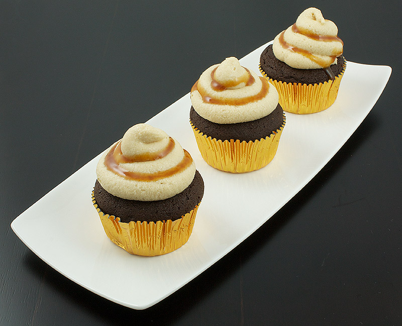 easy cupcake recipes, cupcake photos, best dessert recipes A photo of 3 Caramilk® Cream-Vodka Cooler Cupcakes with Caramel Buttercream Icing.