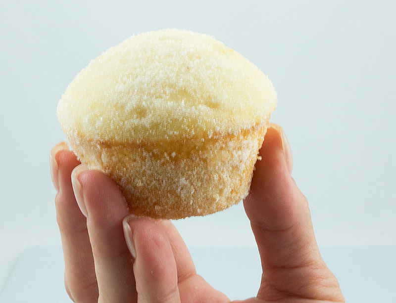 sugar donut muffin recipe, easy chocolate muffin recipe A photo of a person's hand holding a sugar donut muffin.