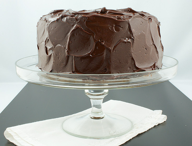 David Lebovitz's Banana Cake with Mocha Frosting A photo of David Lebovitz's Banana Cake with Mocha Frosting displayed on a glass cake stand.