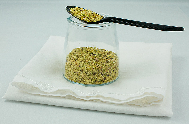 recipe for spritz cookies, butter spritz cookies, homemade gourmet A photo of a glass jar filled with Pistachio Crumb.