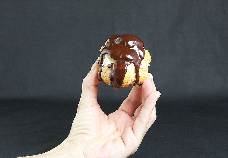 Profiteroles with Vanilla Crème Chantilly and Hot Chocolate Sauce A photo of a Profiterole with Vanilla Crème Chantilly and Hot Chocolate Sauce.