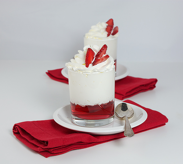 Strawberry Trifle A photo of 2 Strawberry Trifle desserts garnished with fresh berries.