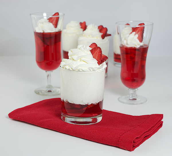 Strawberry Desserts A photo of Strawberry Desserts served in various glass cups and garnished with fresh berries.
