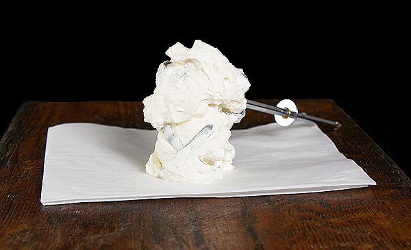 Sweetened Whipped Cream A photo of 2 beater attachments enrobed in freshly whipped Sweetened Whipped Cream.