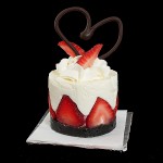 Torta di Fragole e Crema Soffice di Yogurt A photo of Torta di Fragole e Crema Soffice di Yogurt (Yogurt Mousse Cakes with Strawberries) dessert garnished with a swirl of Sweetened Whipped Cream, fresh strawberries and a chocolate heart.