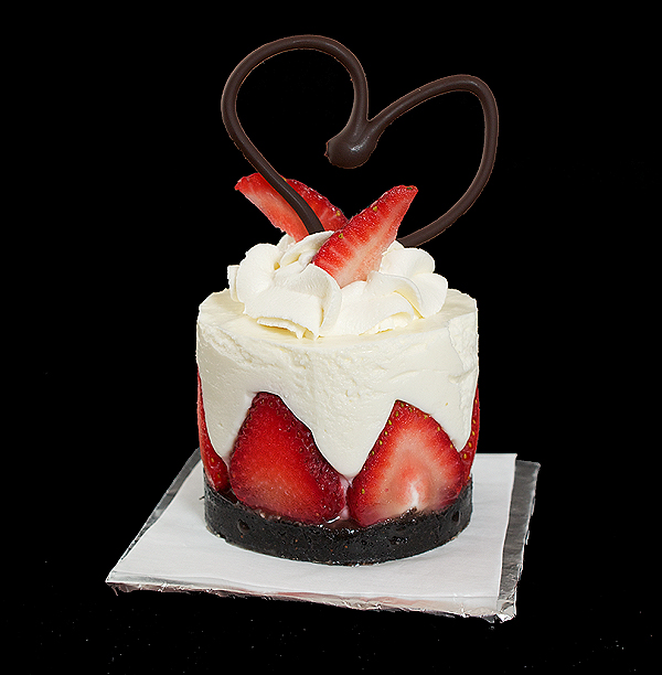 Torta di Fragole e Crema Soffice di Yogurt A photo of Torta di Fragole e Crema Soffice di Yogurt (Yogurt Mousse Cakes with Strawberries) dessert garnished with a swirl of Sweetened Whipped Cream, fresh strawberries and a chocolate heart.