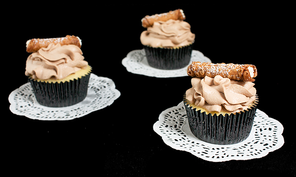 Chocolate Whipped Cream A photo of Cannoli Cupcakes frosted with Marsala spiked Chocolate Whipped Cream.