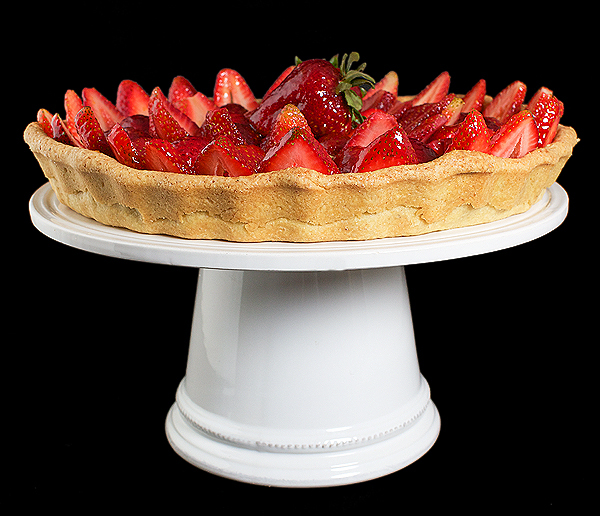 Torta di Fragole A photo of an Italian Cake, Torta di Fragole made with a Hazelnut Pasta Frolla and filled with Crema Pasticcera, topped with fresh strawberries and a thin coating of Grand Marnier-Apricot Glaze.