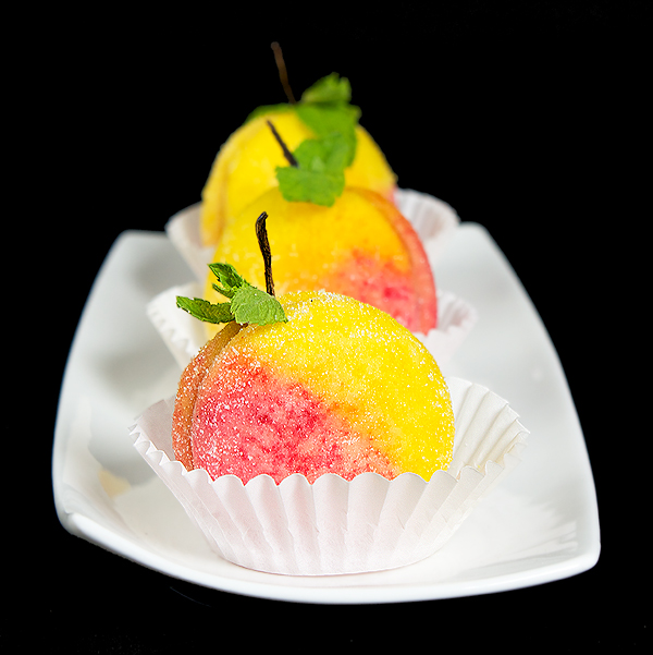 Pesche Dolci {Italian Peach Cookies} A photo of Italian Cookies, Pesche Dolci {Italian Peach Cookies} displayed in a row on a white rectangular dish.