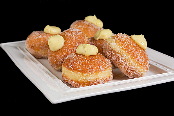 Italian Pastries, Italian Donuts, Italian Desserts A photo of Italian Pastries, Bomboloni, Italian Cream filled donuts rolled in sugar.