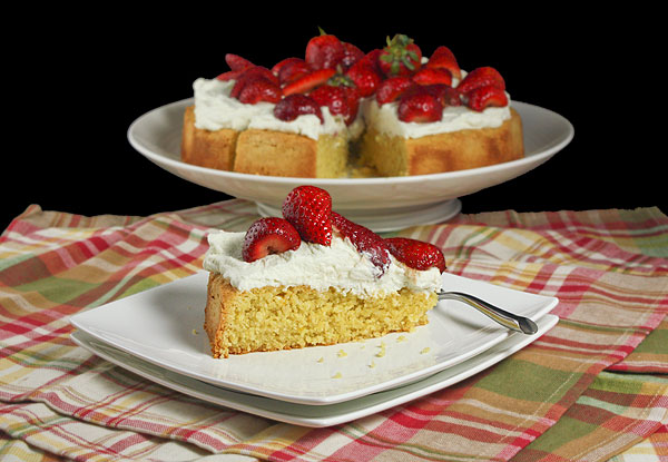 Grace's Sweet Life Mascarpone Cream A photo of a slice of Italian Cake topped with Mascarpone Cream and Balsamic Strawberries.