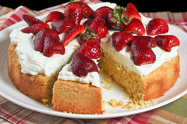Grace's Sweet Life Polenta Cake A photo of Polenta Cake decorated with whipped Mascarpone Cream and Balsamic and Brown Sugar Strawberries.