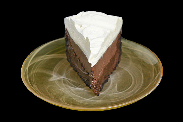 Mud Pie Recipe A photo taken of a slice of Mud Pie on a yellow dessert plate.