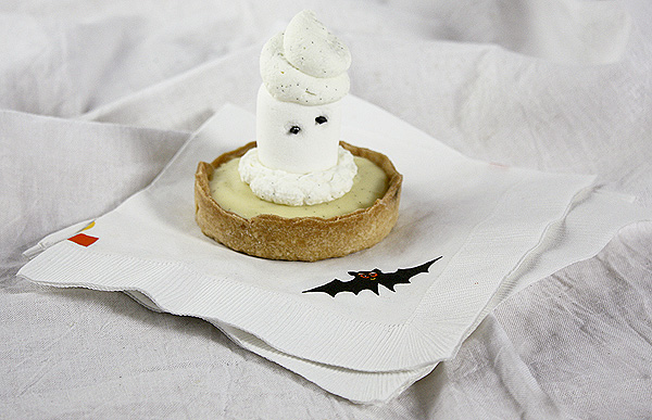 Grace's Sweet Life Marshmallow Ghost Tart A photo of a Marshmallow Ghost Tart displayed on paper Halloween bat napkins.