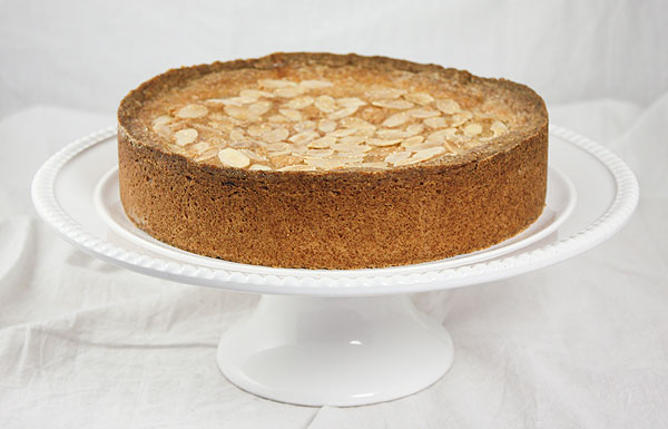 Photo taken looking down on Blackberry-Almond Shortbread Cake topped with demerara sugar and sliced almonds.